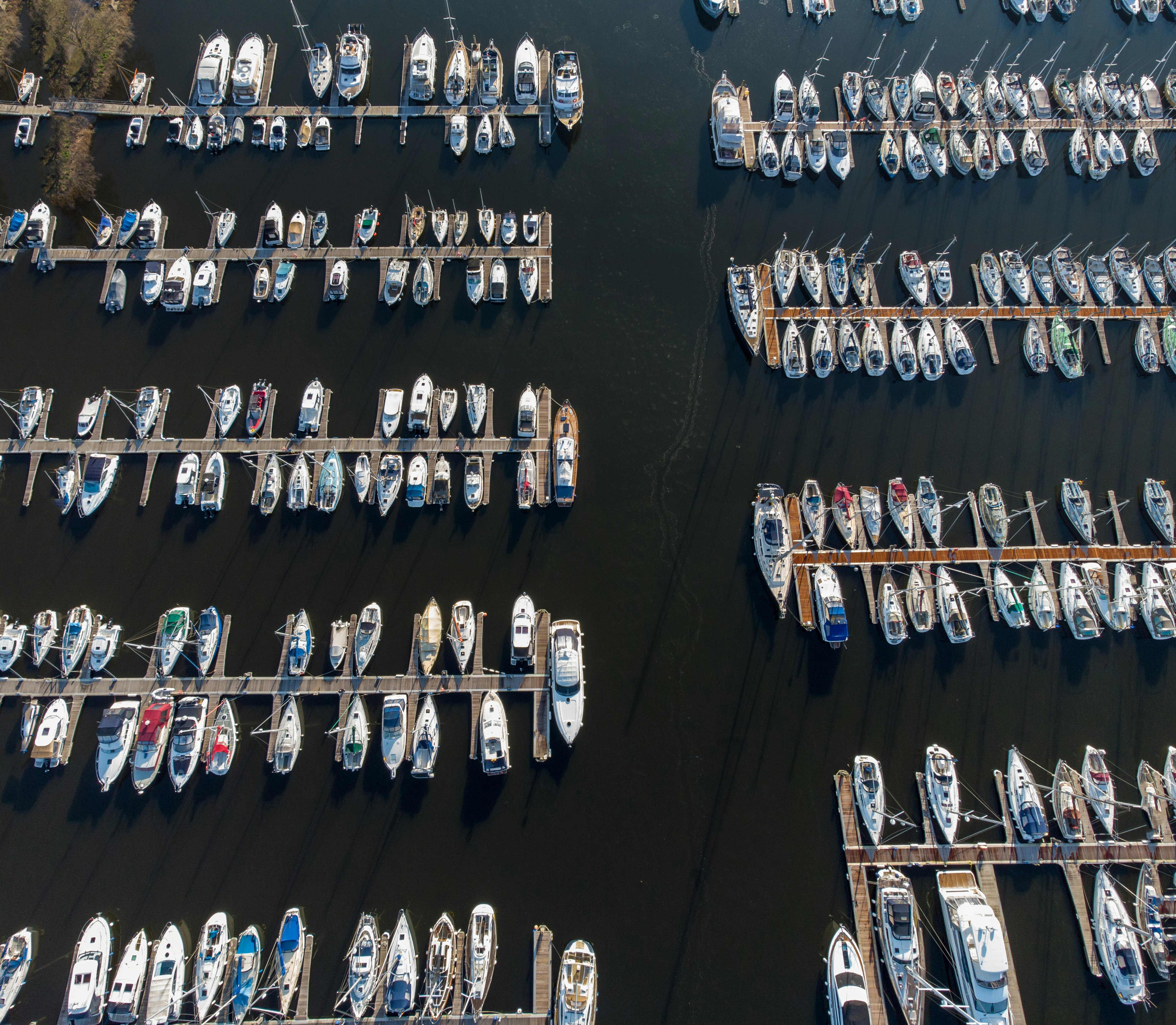 aerial view of cars parked on parking lot during daytime